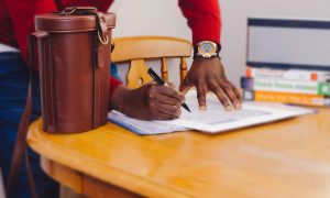northwood-man-writing-documents-on-table