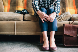 woman-sitting-on-couch